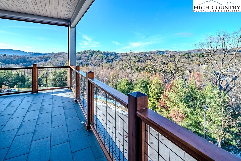 215 Cone Vista Circle, Unit B Blowing Rock, NC 28605 - Photo 37 of 50 a view of balcony with wooden floor and fence