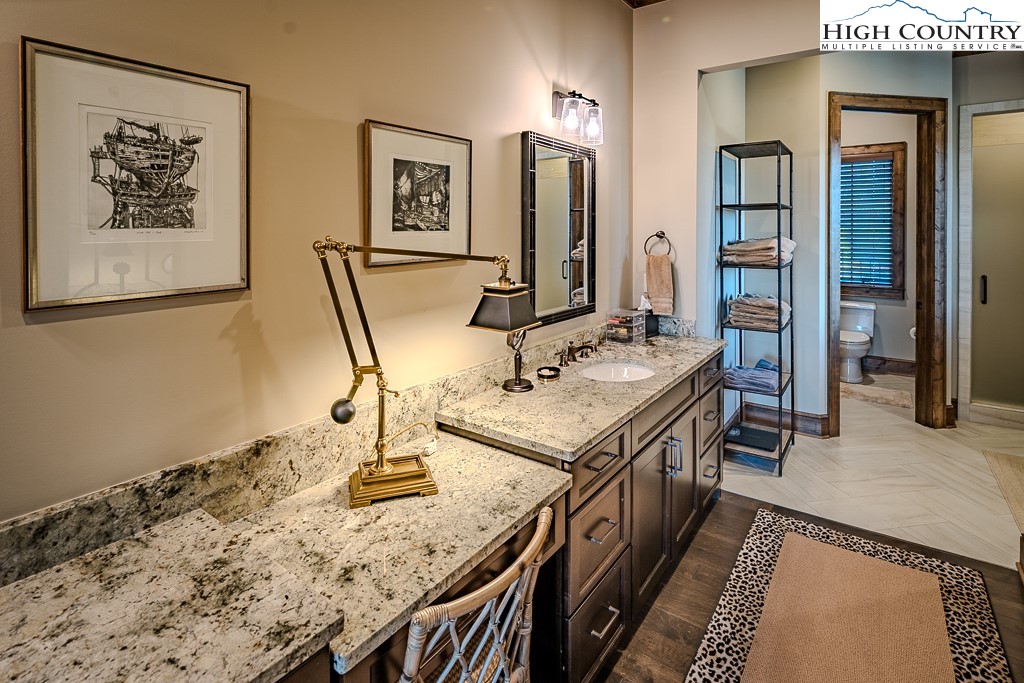 215 Cone Vista Circle, Unit B Blowing Rock, NC 28605 - Photo 40 of 50 a bathroom with a sink and a mirror