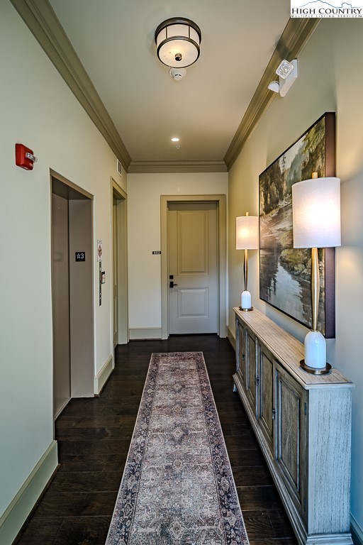 215 Cone Vista Circle, Unit B Blowing Rock, NC 28605 - Photo 4 of 50 a view of a hallway with wooden floor and staircase