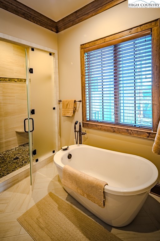 215 Cone Vista Circle, Unit B Blowing Rock, NC 28605 - Photo 42 of 50 a bathroom with a bathtub and a shower