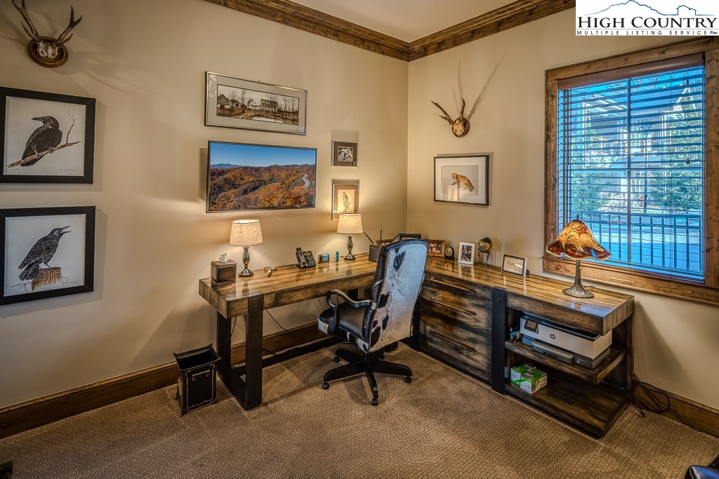 215 Cone Vista Circle, Unit B Blowing Rock, NC 28605 - Photo 44 of 50 a view of a workspace with furniture and a window