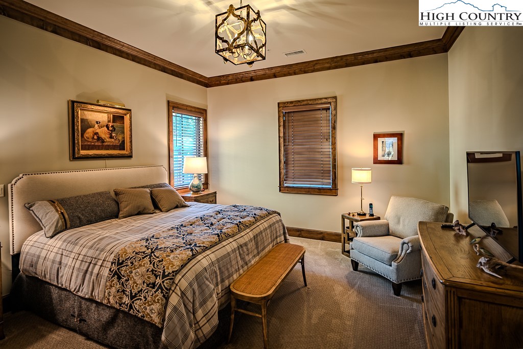 215 Cone Vista Circle, Unit B Blowing Rock, NC 28605 - Photo 46 of 50 a bedroom with a bed couch and a window