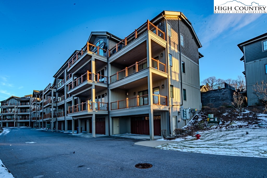 215 Cone Vista Circle, Unit B Blowing Rock, NC 28605 - Photo 48 of 50 a front view of a house with a yard