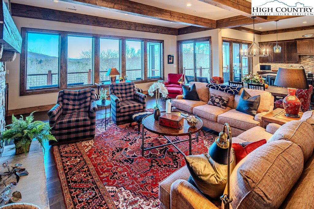 215 Cone Vista Circle, Unit B Blowing Rock, NC 28605 - Photo 7 of 50 a living room with furniture and a large window