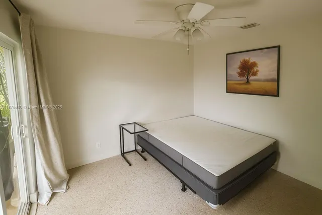 a room with a bed and a window