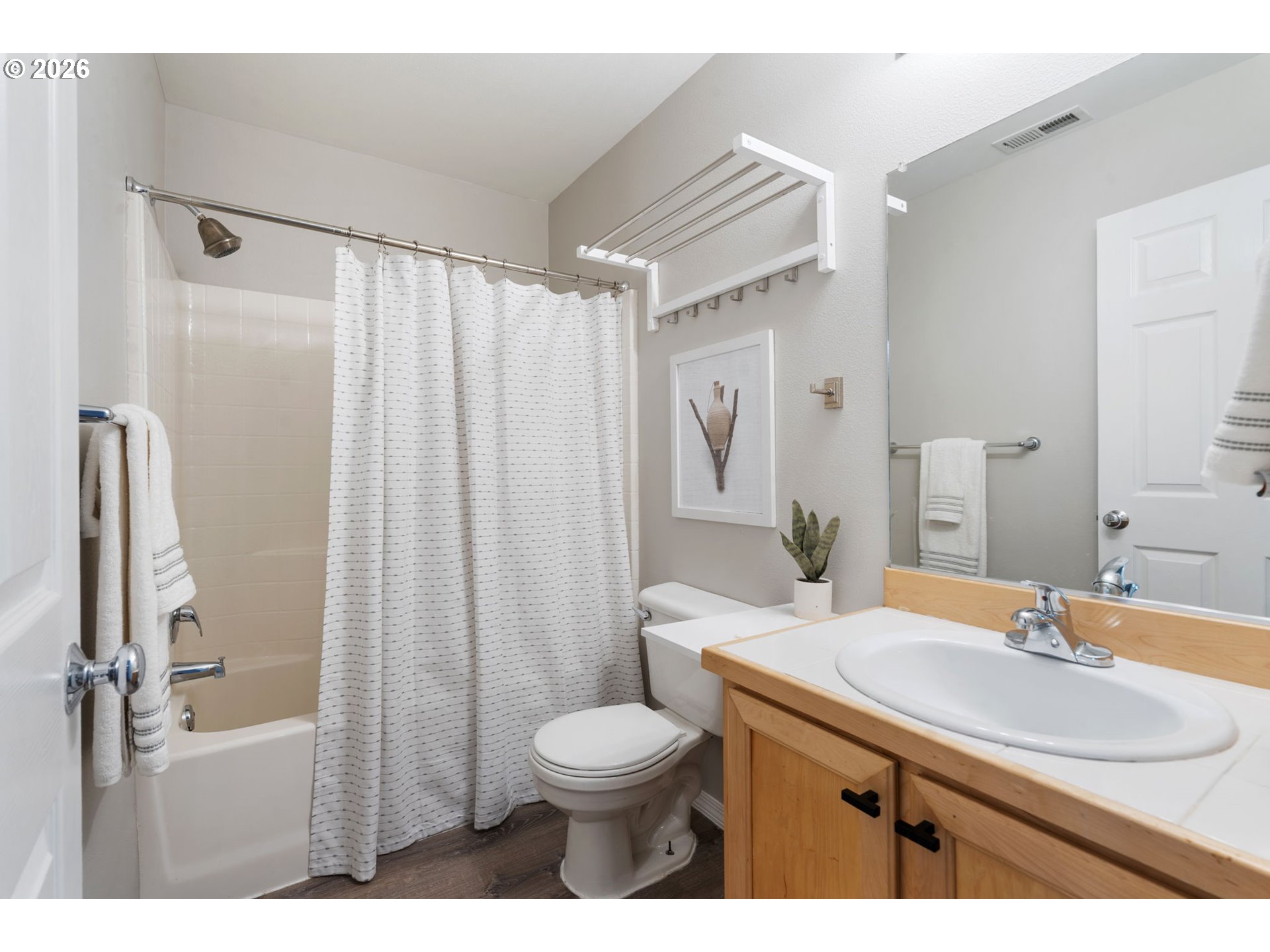 13159 Southwest Brianne Way Portland, OR 97223 - Photo 21 of 32 a bathroom with a sink toilet a mirror and shower