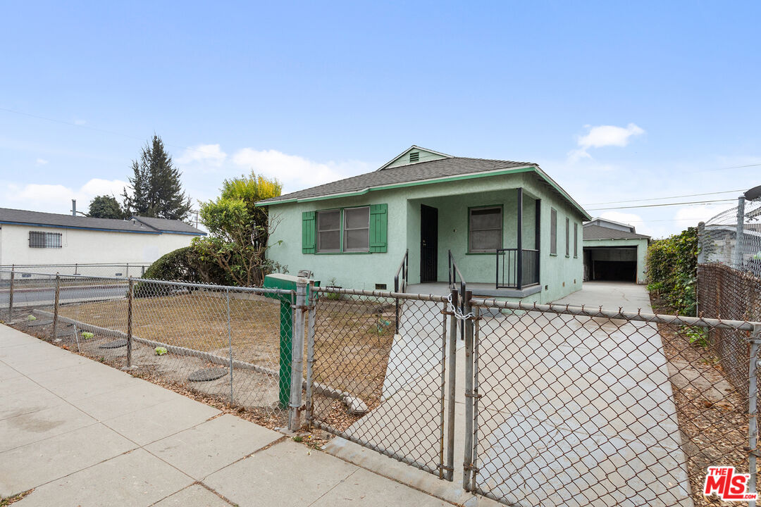 1976 East 112th Street Los Angeles, CA 90059 - Photo 1 of 24 a view of a house with backyard