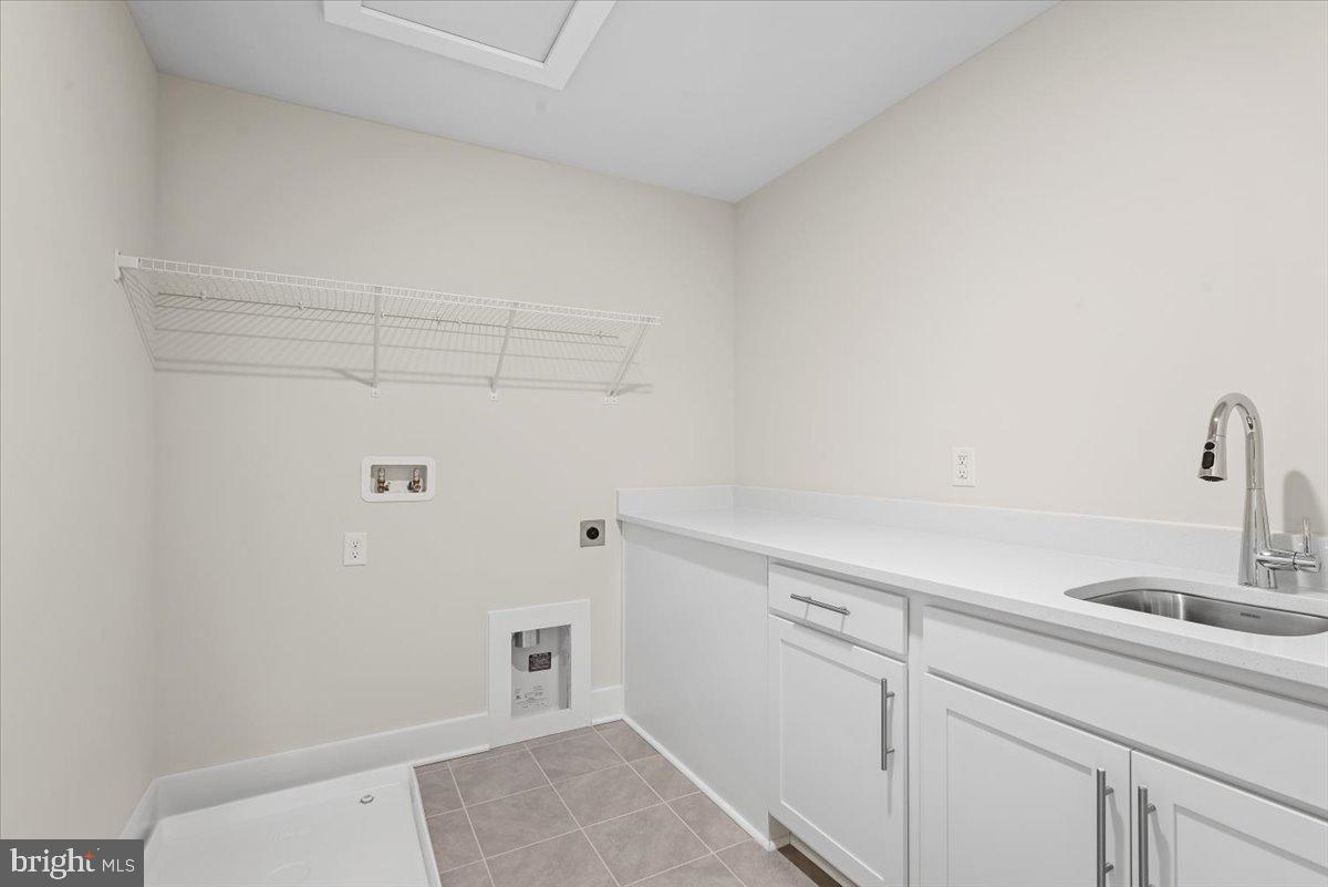 3900 Logmill Road Gainesville, VA 20155 - Photo 30 of 47 Upstairs laundry with cabinets
