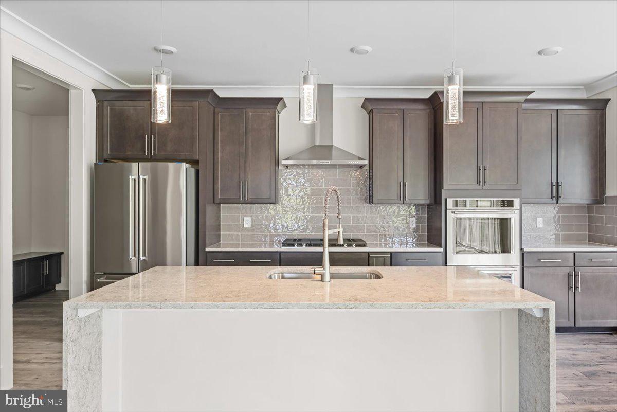 3900 Logmill Road Gainesville, VA 20155 - Photo 6 of 47 Quartz kitchen island and countertops.