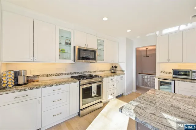 a swimming pool with outdoor seating and yard