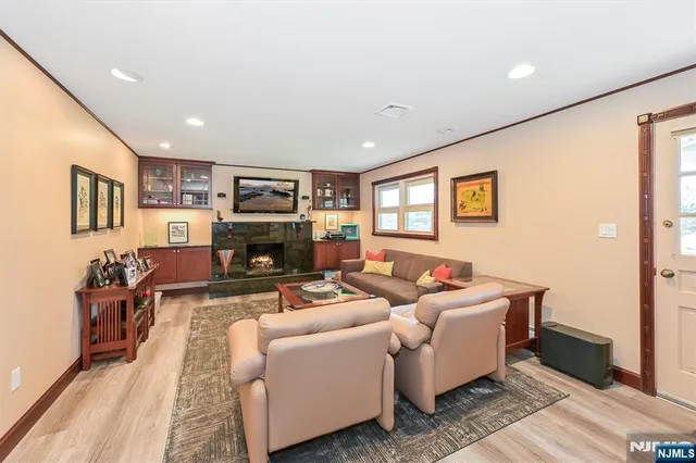 an aerial view of a house with a yard basket ball court and outdoor seating