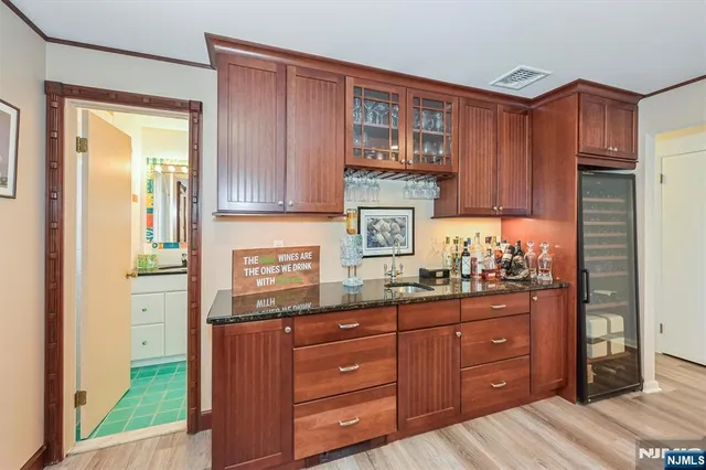 a front view of a house with a yard table and chairs