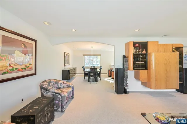 a kitchen with kitchen island granite countertop a refrigerator stove microwave and sink