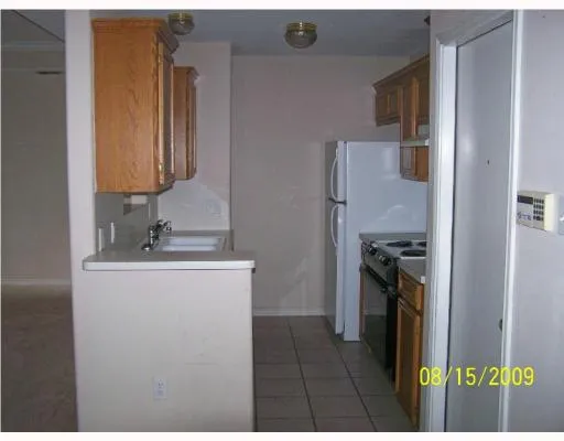 a kitchen with a stove and a refrigerator