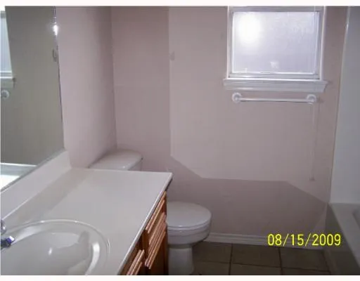 a bathroom with a toilet and a sink