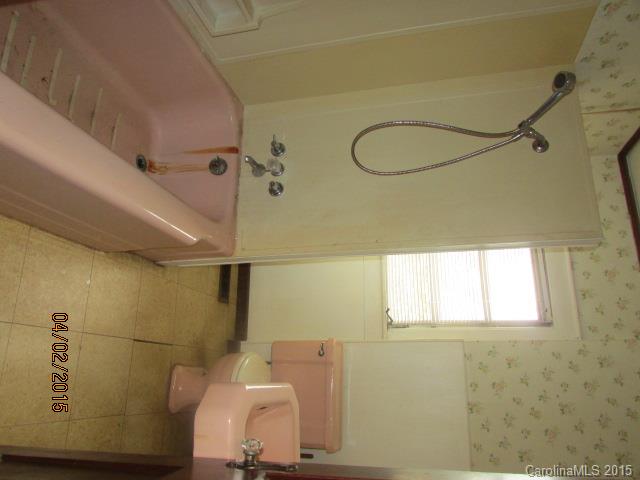 3839 Banoak Road Vale, NC 28168 - Photo 11 of 17 a bath tub sitting next to a white sink and a shower