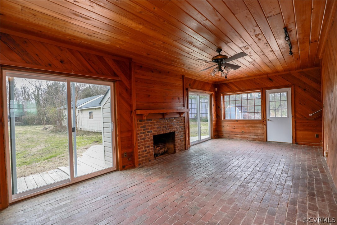 1737 New Market Road Henrico, VA 23231 - Photo 20 of 50 family room with brick floor and tongue and grove paneling