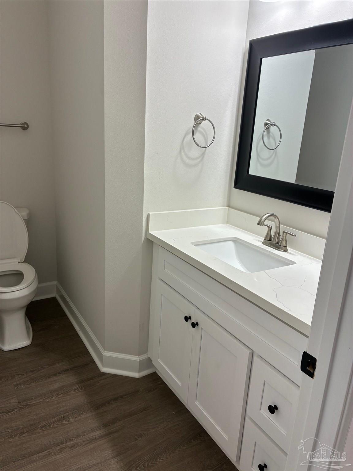 4090 Manchester Court Pace, FL 32571 - Photo 15 of 33 a bathroom with a toilet sink and mirror