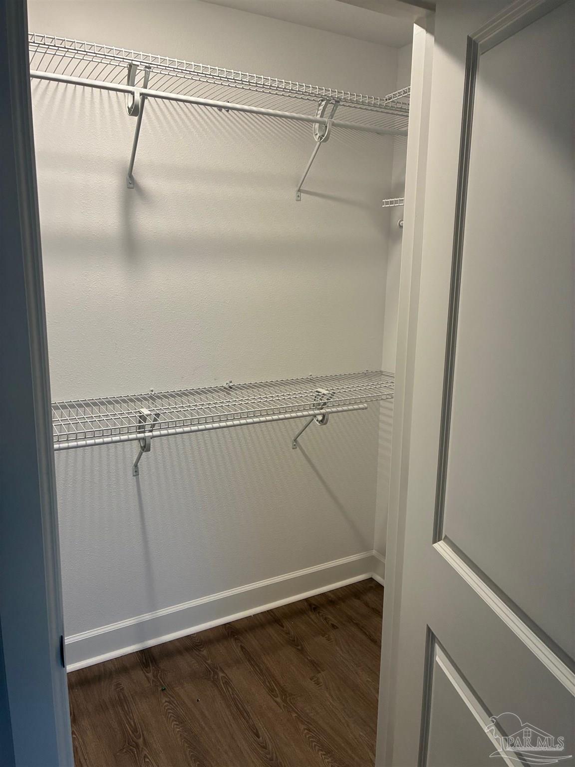 4090 Manchester Court Pace, FL 32571 - Photo 19 of 33 a view of a room with racks on the wall