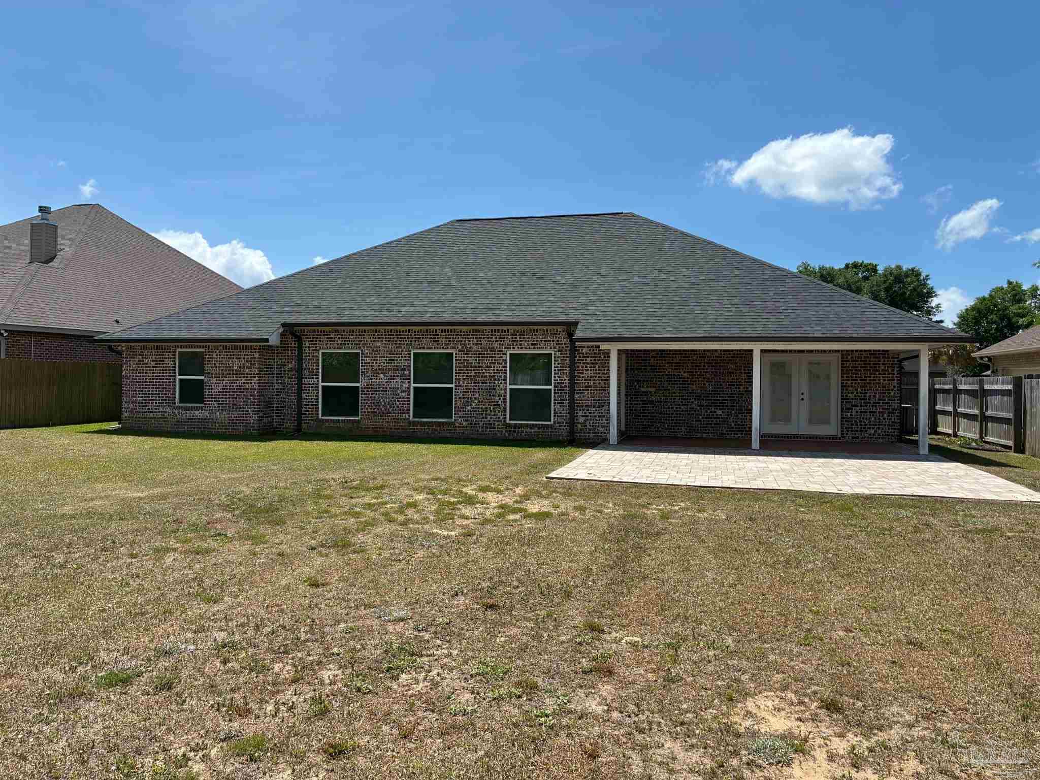 4090 Manchester Court Pace, FL 32571 - Photo 25 of 33 front view of a house with a yard
