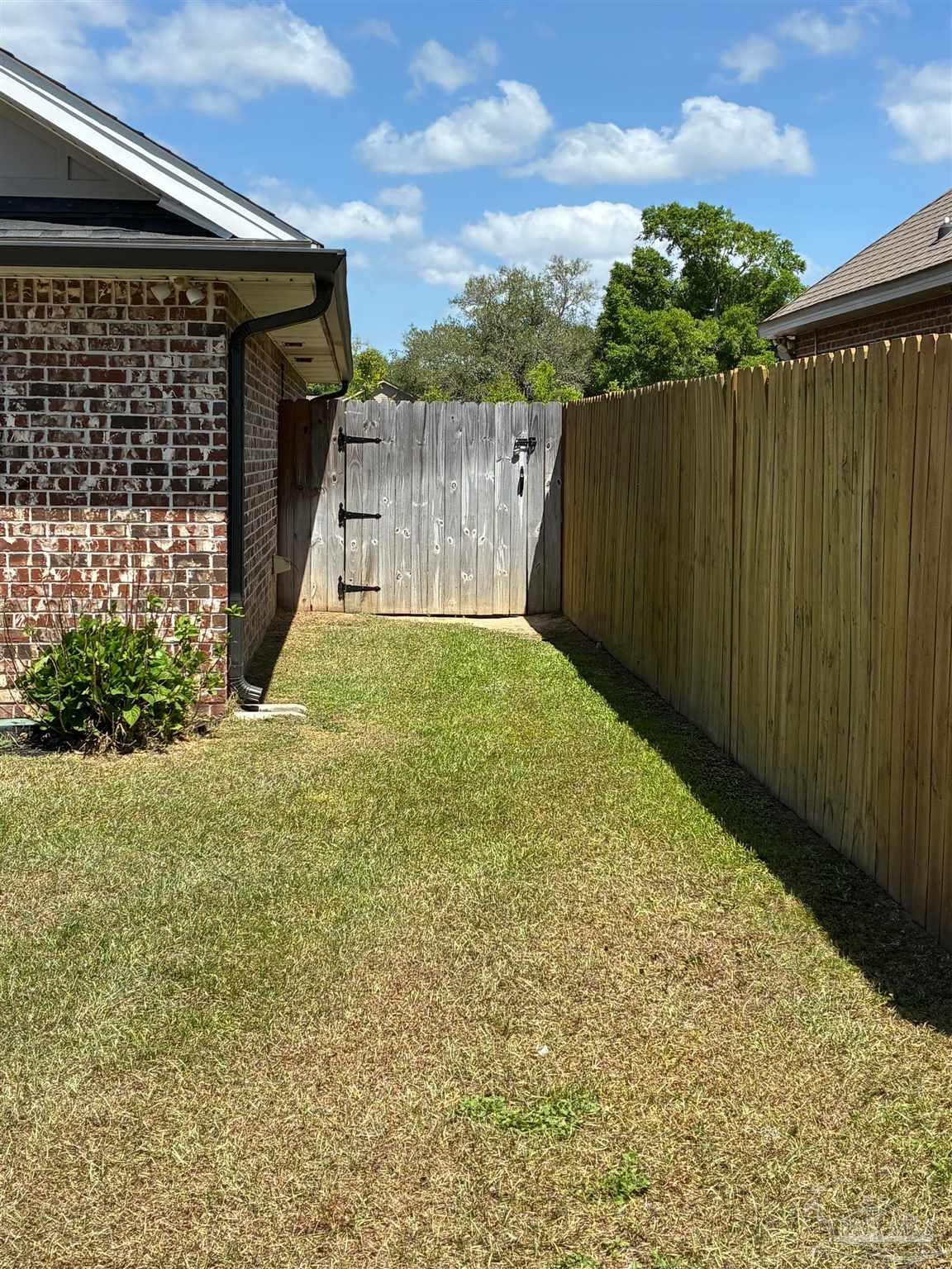 4090 Manchester Court Pace, FL 32571 - Photo 29 of 33 a view of a backyard