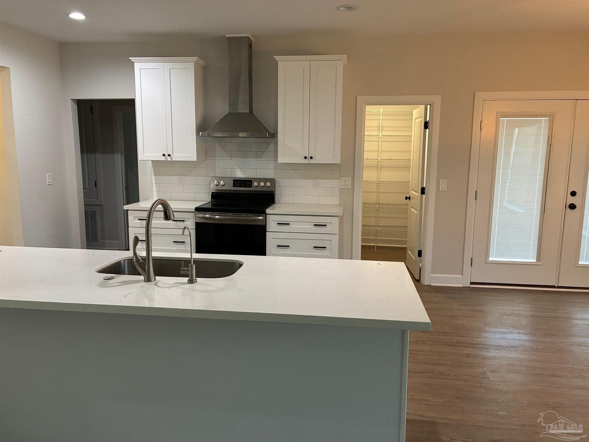 4090 Manchester Court Pace, FL 32571 - Photo 3 of 33 a kitchen with appliances and cabinets
