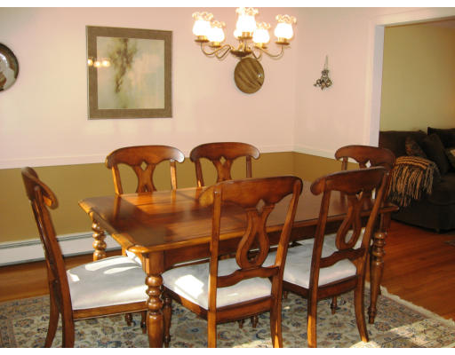12 Lowry Road Framingham, MA 01701 - Photo 3 of 12 a view of a dining room with furniture and chandelier