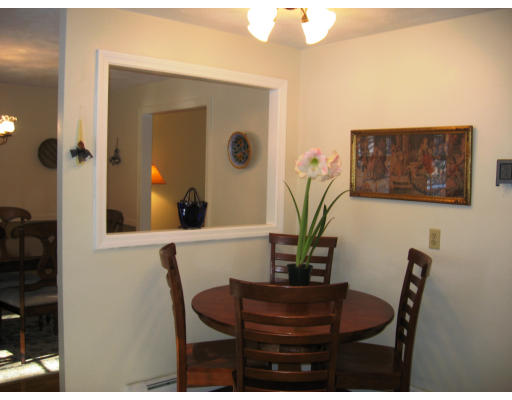 12 Lowry Road Framingham, MA 01701 - Photo 4 of 12 a view of a dining room with furniture and wooden floor