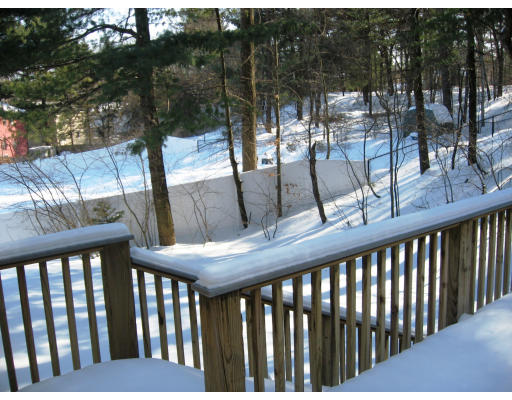 12 Lowry Road Framingham, MA 01701 - Photo 10 of 12 a view of a balcony with chairs and wooden fence