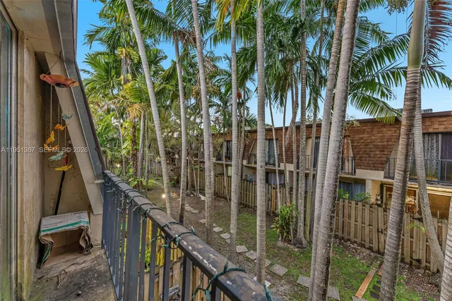 a view of balcony with wooden fence