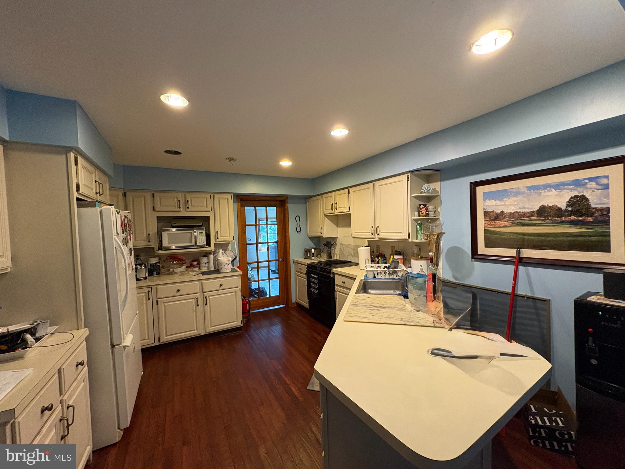 36 White Pine Road Chesterfield, NJ 08515 - Photo 19 of 33 a kitchen with sink refrigerator dining table and chairs