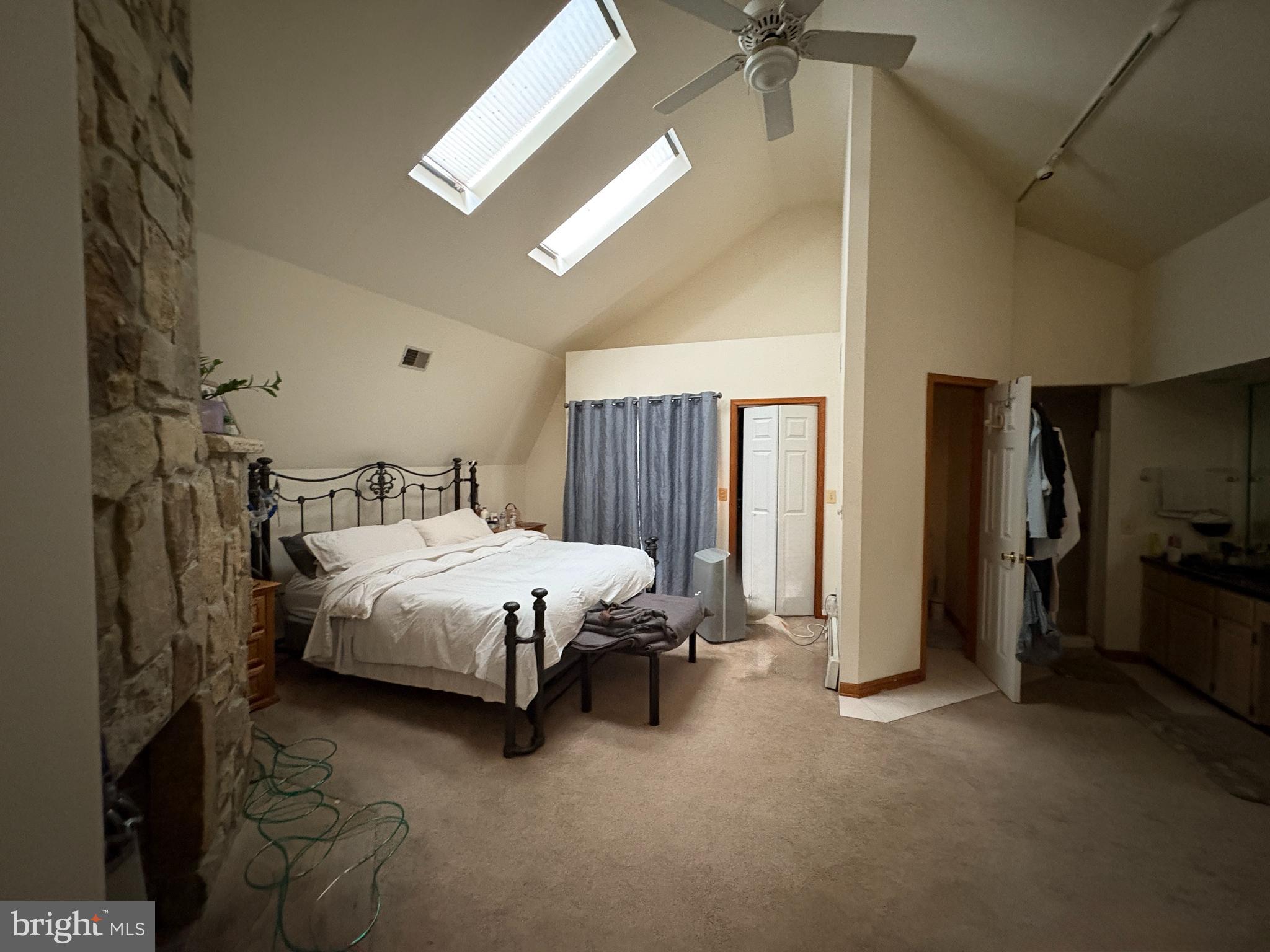 36 White Pine Road Chesterfield, NJ 08515 - Photo 28 of 33 a bedroom with a bed and a chandelier