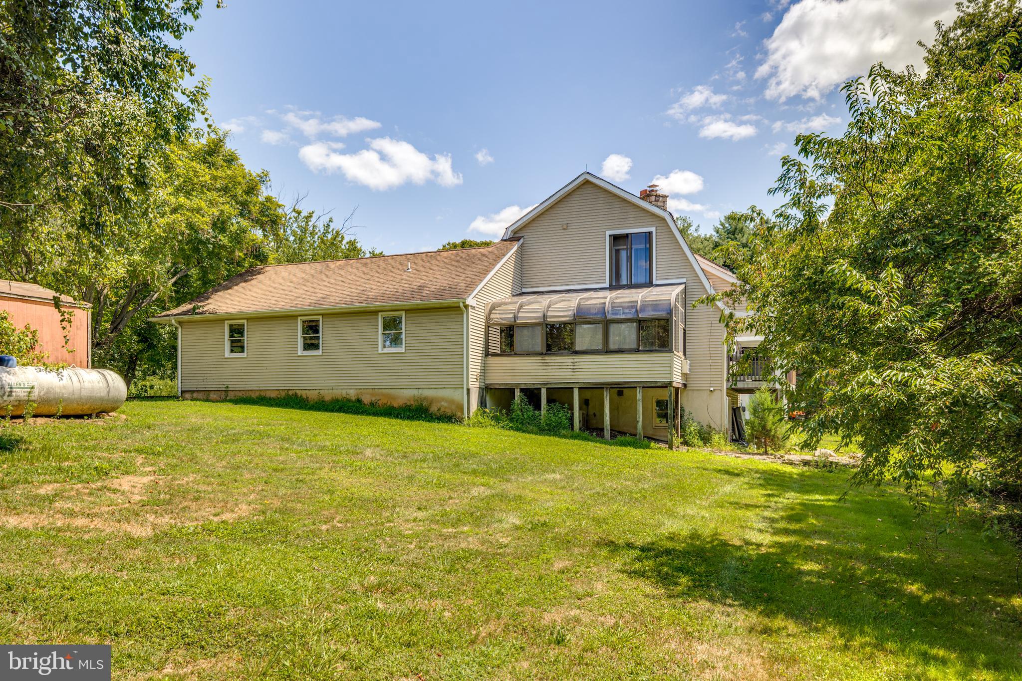 36 White Pine Road Chesterfield, NJ 08515 - Photo 5 of 33 a front view of a house with a garden