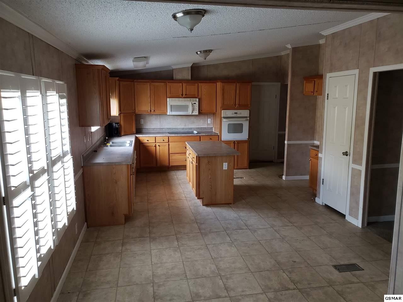 1033 Beard Valley Road Maynardville, TN 37807 - Photo 3 of 22 a kitchen with stainless steel appliances a refrigerator and a sink