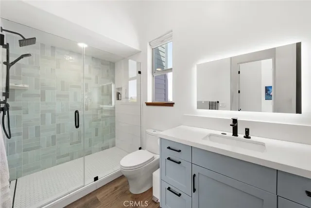 an aerial view of a house with a garden and plants