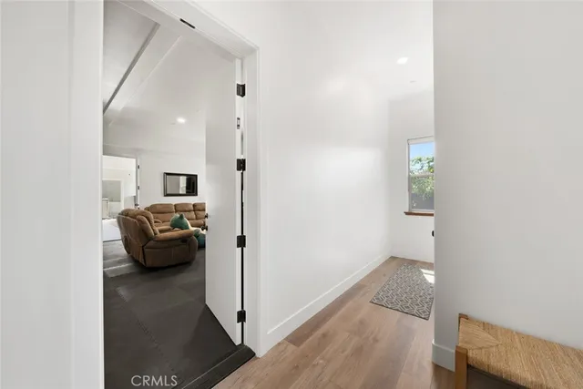 a bed room with a bed and windows