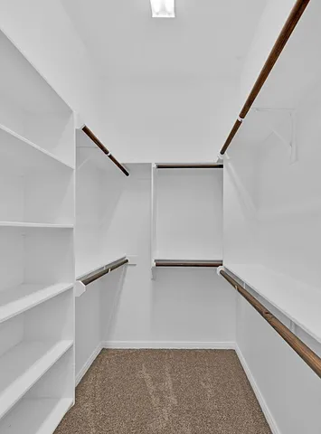 a view of an empty walk in closet