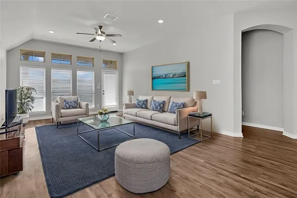 a living room with furniture and a large window