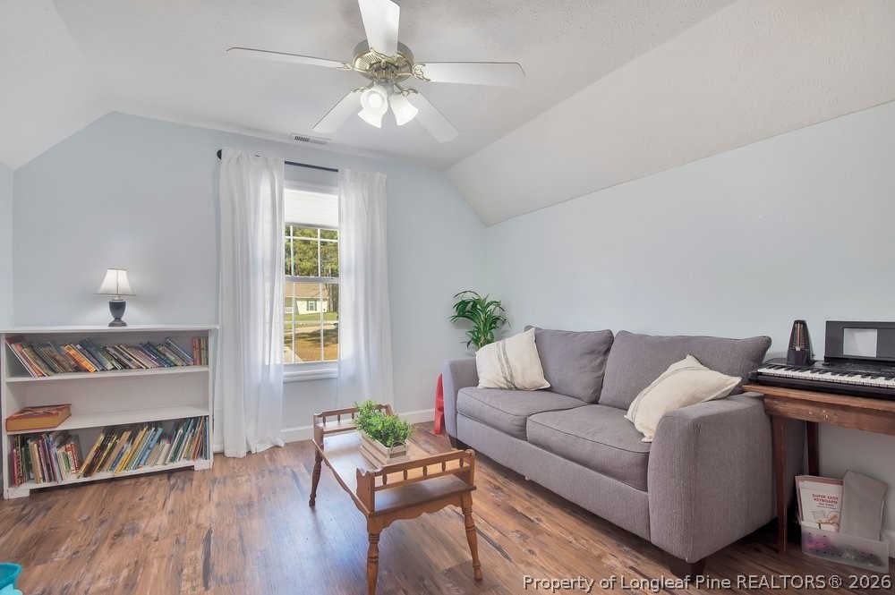 419 Senter Lane Bunnlevel, NC 28323 - Photo 29 of 49 a living room with furniture and a wooden floor
