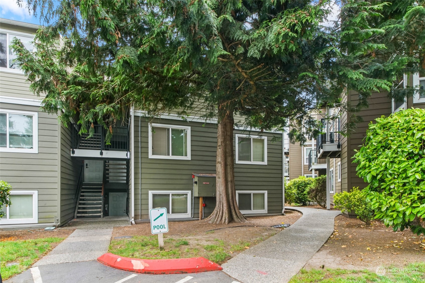 820 Cady Road, Unit A305 Everett, WA 98203 - Photo 15 of 26 a front view of a house with a garden