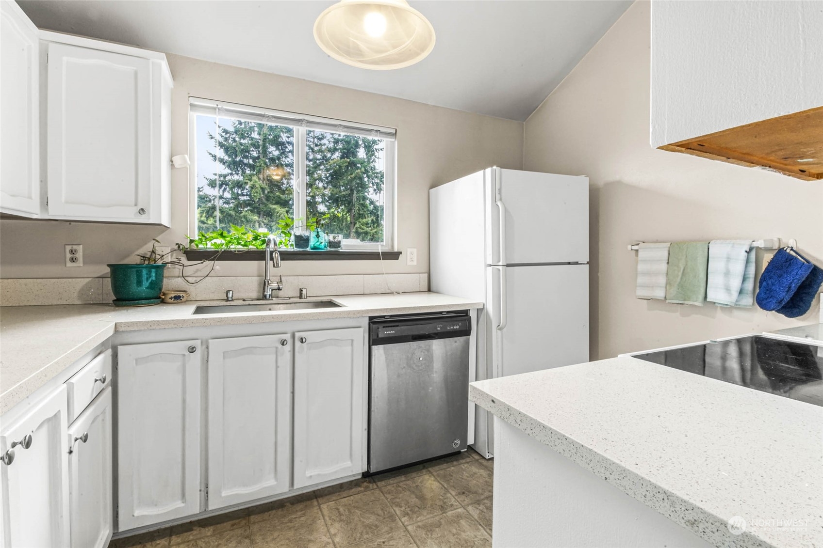 820 Cady Road, Unit A305 Everett, WA 98203 - Photo 4 of 26 a kitchen with white cabinets and white appliances