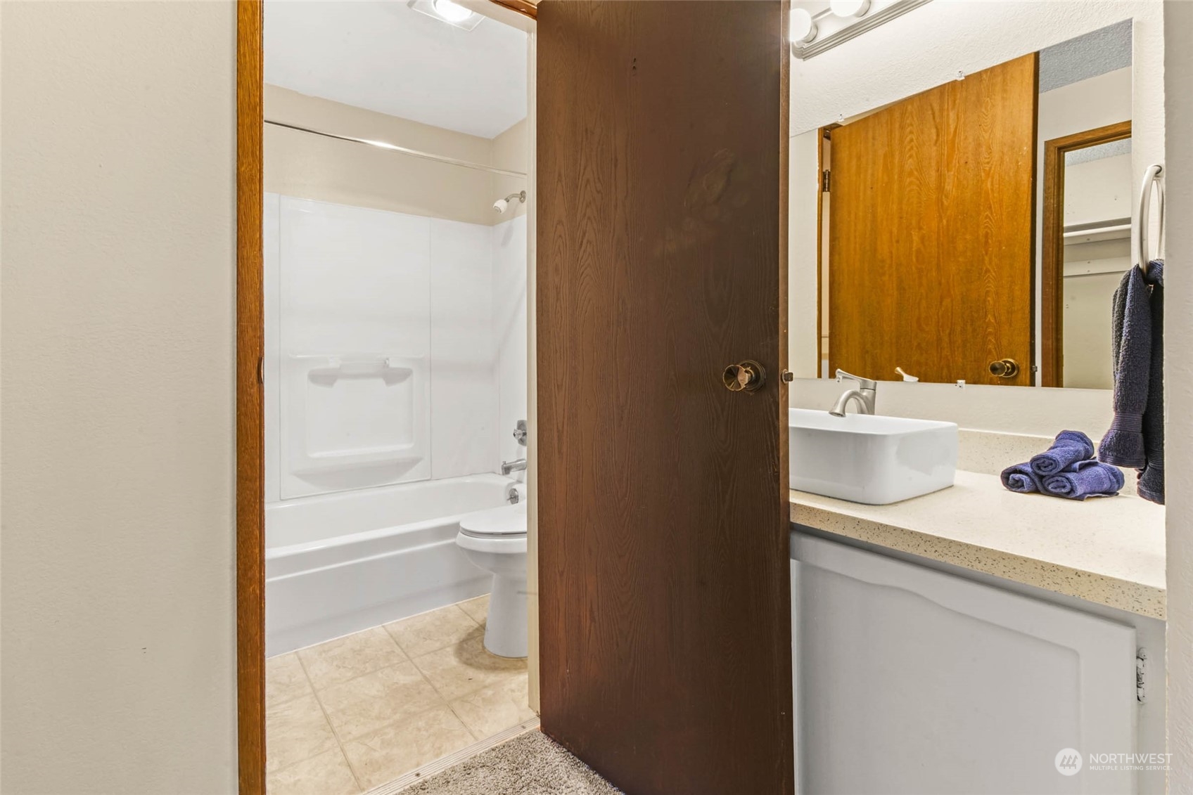 820 Cady Road, Unit A305 Everett, WA 98203 - Photo 6 of 26 a bathroom with a sink and a mirror