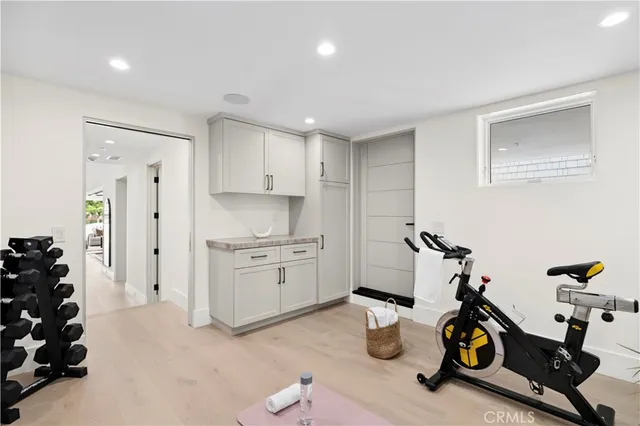 a kitchen with a sink cabinets and window