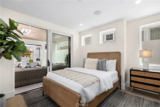 a bathroom with a granite countertop toilet sink and mirror