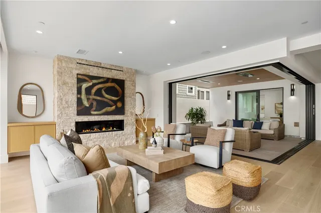 a living room with furniture a window and a table