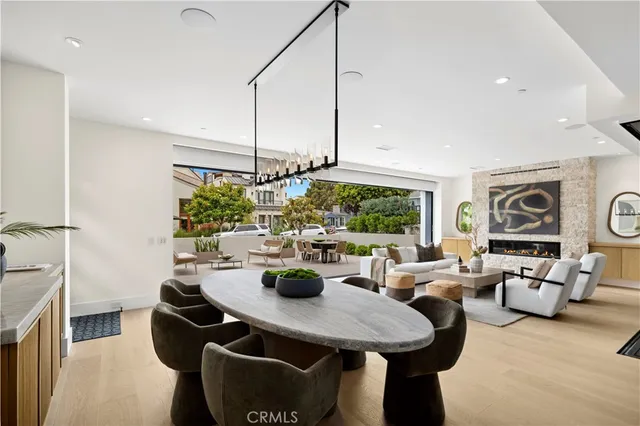 a dining table with wooden floor and glass top table