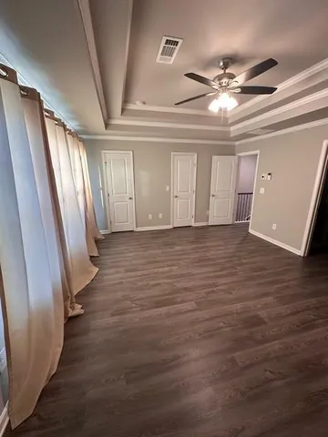wooden floor in an empty room with a mirror