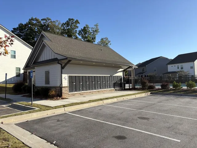 a view of a house with swimming pool in front of it