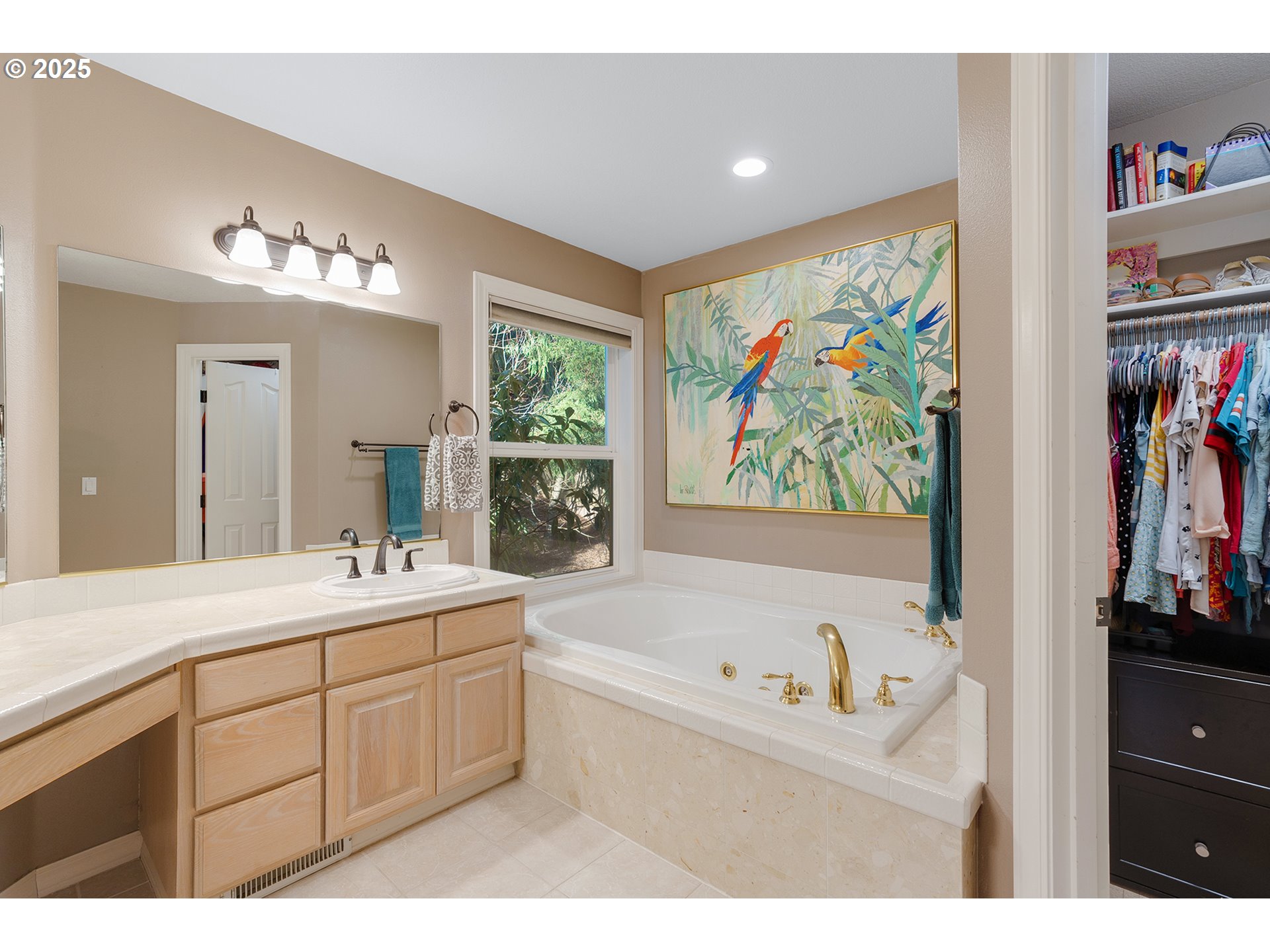 15943 Southwest Enna Court Portland, OR 97224 - Photo 25 of 48 a bathroom with a sink mirror and a bathtub