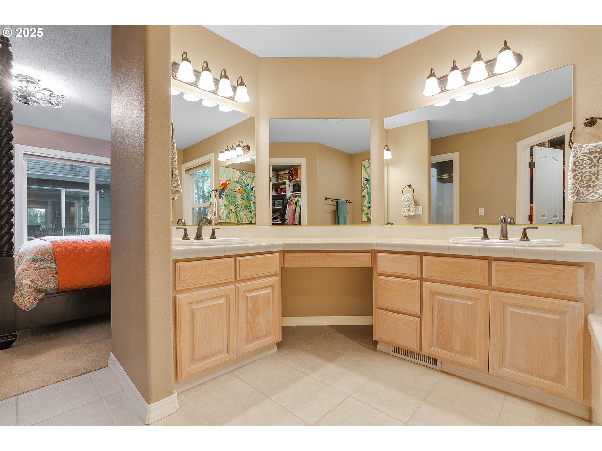 15943 Southwest Enna Court Portland, OR 97224 - Photo 26 of 48 a spacious bathroom with a granite countertop sink a mirror and a
